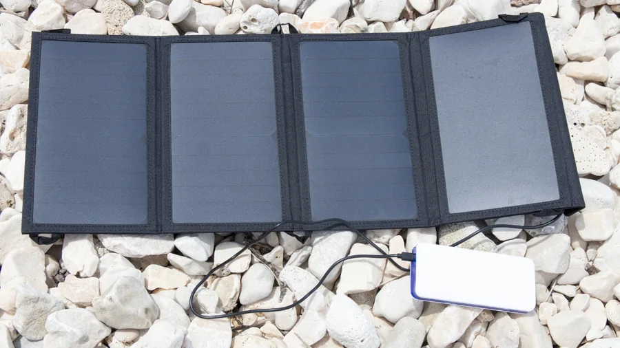 Foldable solar panel laid out for charging